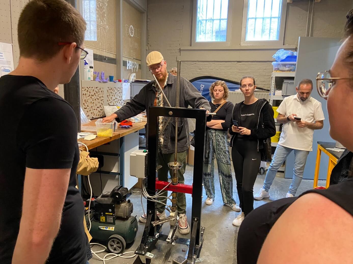 A man showing how a machine works